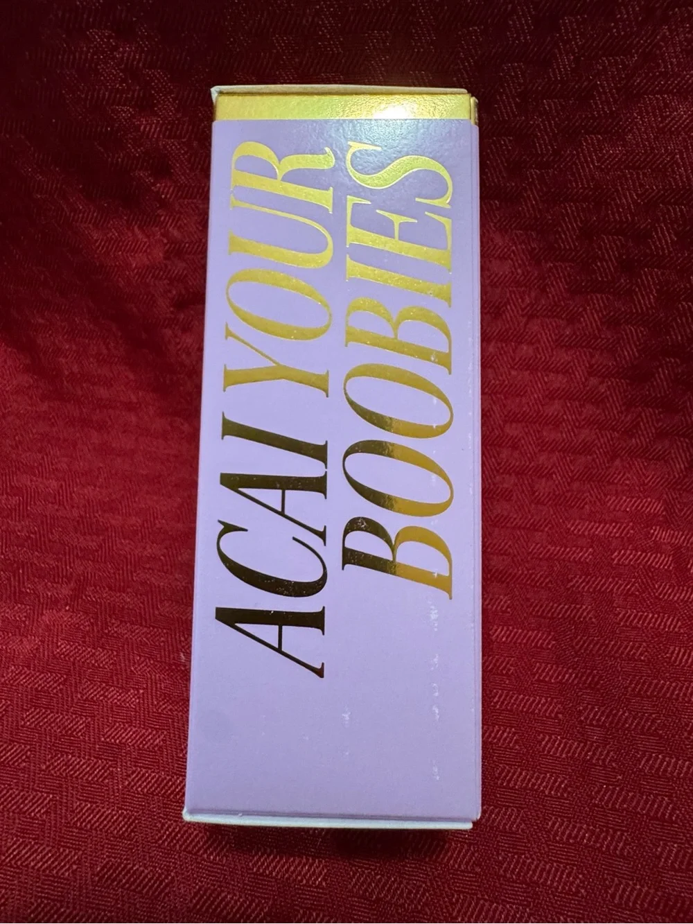 TRULY Firming Body Serum in Purple and Gold Accents